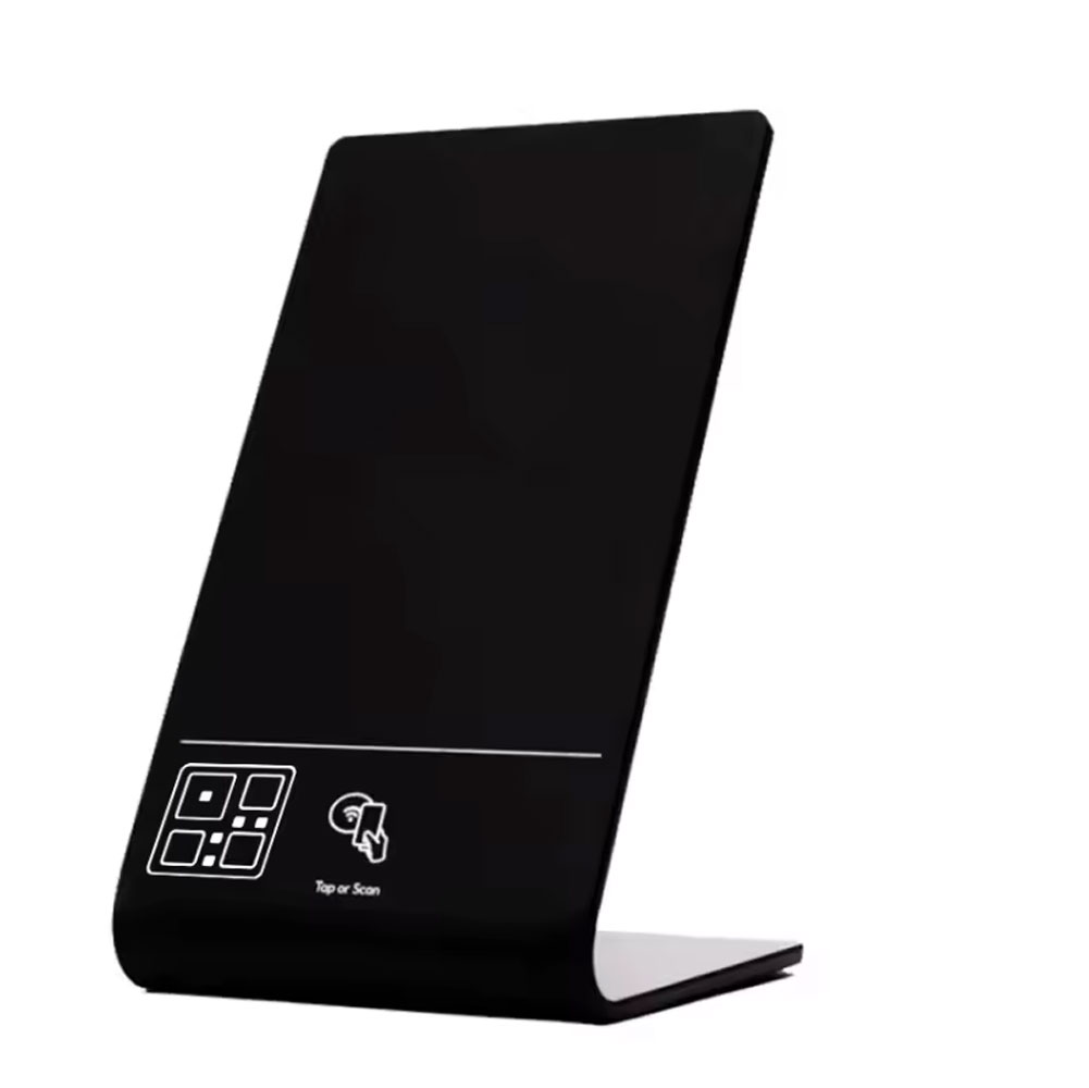 A black angled counter stand marked Tap or Scan.